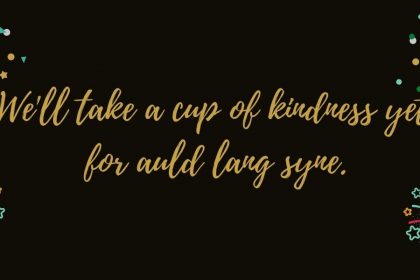 A decorative image with a black background and fireworks in the corners, with the words "We'll take a cup of kindness yet for auld lang syne."