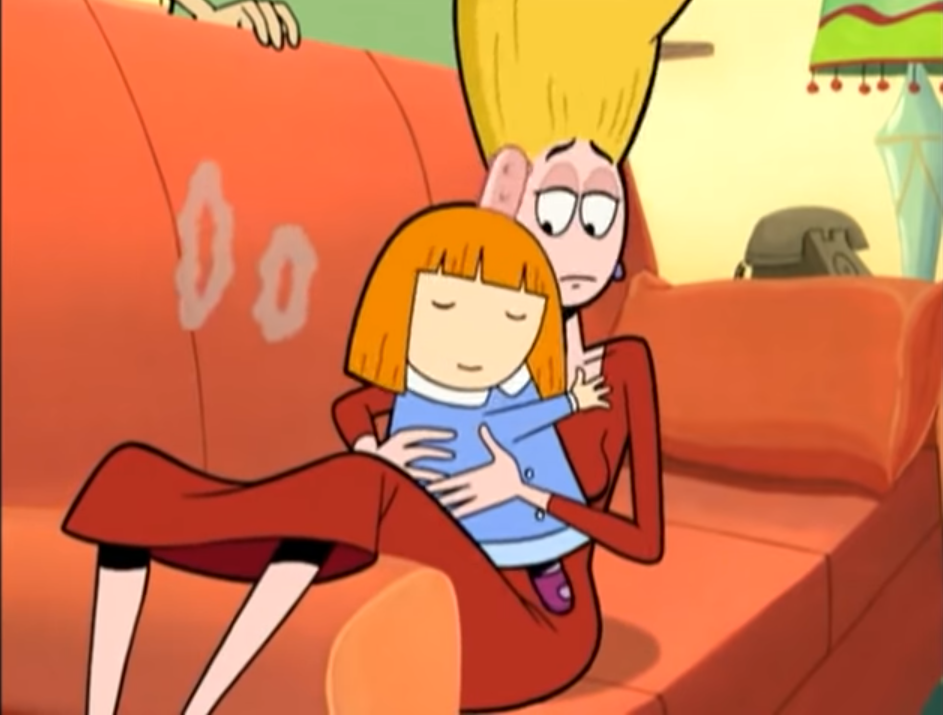 Screenshot of an episode of The Oblongs, where Pickles lays on an orange couch, with baby Beth sitting up on top of her. Pickles is trying to win a shopping spree from Le Smoke, so she's chain smoking in order to find the winner. Pickles lays on the couch and can't take another puff. She gets the winner, and Beth gets hugs and kisses. Beth blows two smoke rings, as shown in the screenshot. 